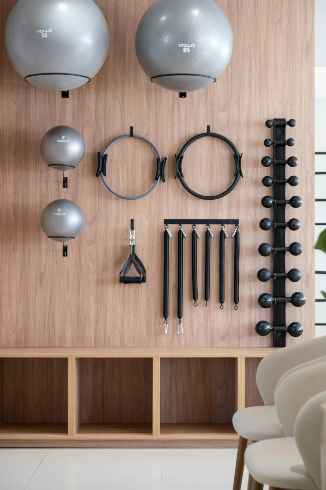 Fitness studio wall with exercise balls, rings and resistance bands