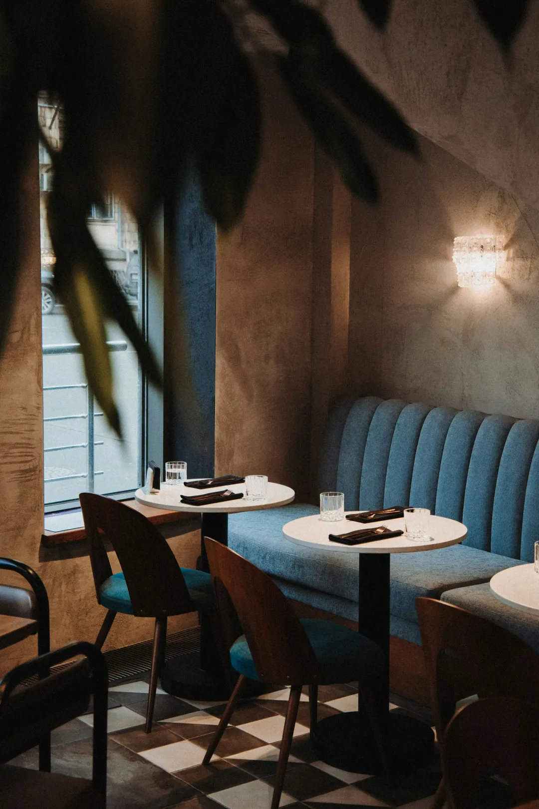 Restaurant dining room with booths and set tables